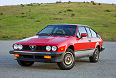 AUT 23 RK1740 01
1981 Alfa Romeo GTV6 Coupe Red 3/4 Front View On Pavement By Hills