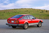 AUT 23 RK1745 01
1981 Alfa Romeo GTV6 Coupe Red 3/4 Rear View On Pavement By Hills