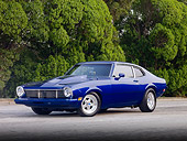 AUT 23 RK1806 01
1973 Ford Maverick Blue 3/4 Front View On Pavement By Trees