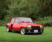 AUT 24 RK0133 03
1985 Renault 5 Turbo 2 Red Low 3/4 Front View On Grass Trees Background