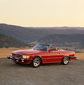 AUT 24 RK0008 03
1987 Mercedes-Benz Convertible Red 3/4 Side View On Dirt Hills Background