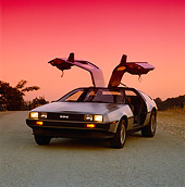 AUT 24 RK0023 02
1980's Delorean Silver 3/4 Front View Doors Open On Pavement Filtered