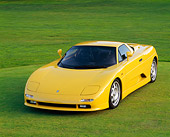 AUT 25 RK0109 09
1996 De Tomaso Guara Yellow Front 3/4 View On Grass