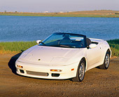 AUT 25 RK0524 03
1991 Lotus Elan Convertible White 3/4 Front View On Dirt By Water
