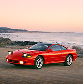 AUT 25 RK0595 02
1991 Dodge Stealth Red 3/4 Front View On Sand By Ocean Filtered