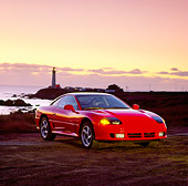 AUT 25 RK0596 02
1991 Dodge Stealth Red 3/4 Front View On Sand By Ocean At Dusk
