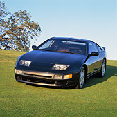 AUT 25 RK0792 05
1990 Nissan 300ZX Turbo Black 3/4 Front View On Grass Hill Blue Sky
