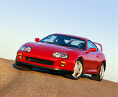 AUT 25 RK0867 02
1993 Toyota Supra Red 3/4 Front Slanted View On Pavement Hill Blue Sky