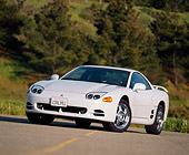 AUT 25 RK0869 15
1994 Mitsubishi 3000 V4 White Low 3/4 Front View On Pavement Trees