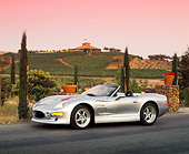 AUT 25 RK1111 06
1999 Shelby Series 1 Convertible Silver 3/4 Side View On Pavement Filtered