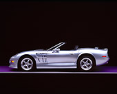 AUT 25 RK1124 06
1999 Shelby Series 1 Convertible Silver Side View On Purple Floor Gray Line Studio