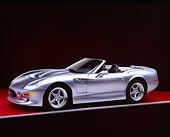 AUT 25 RK1125 03
1999 Shelby Series 1 Convertible Silver 3/4 Side View On Red Floor Gray Line Studio