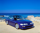 AUT 25 RK1246 03
1991 Acura Integra Custom Blue 3/4 Front View On Sand By Ocean Blue Sky