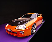 AUT 25 RK1268 12
1995 Toyota Supra Custom Orange And Black Wide Angle 3/4 Front View On Purple Floor Gray Line