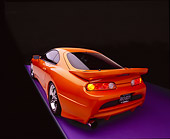 AUT 25 RK1269 09
1995 Toyota Supra Custom Orange And Black Wide Angle Rear 3/4 Rear View On Gray Line Purple Floor Studio