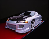 AUT 25 RK1281 16
1998 Mitsubishi Custom Modified Eclipse GS Silver And Black Wide Angle 3/4 Front View On Red Floor