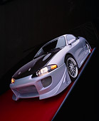 AUT 25 RK1281 22
1998 Mitsubishi Custom Modified Eclipse GS Silver And Black Wide Angle 3/4 Front View On Red Floor