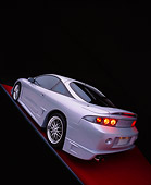 AUT 25 RK1282 13
1998 Mitsubishi Custom Modified Eclipse GS Silver And Gray Wide Angle 3/4 Rear On Red Floor Studio