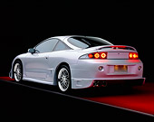 AUT 25 RK1284 01
1998 Mitsubishi Custom Modified Eclipse GS Silver And Black 3/4 Rear View On Red Floor Gray Line Studio