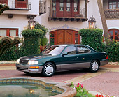AUT 25 RK0046 02
1996 Lexus LS400 Green 3/4 Side View On Brick Floor By Building