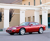 AUT 25 RK0052 03
1997 XK8 Jaguar Burgundy Side 3/4 View In Parking Lot By Building