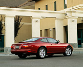 AUT 25 RK0054 02
1997 Jaguar XK8 Burgundy Rear 3/4 View On Pavement By White Pillars