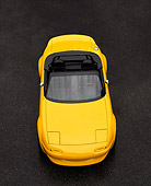AUT 25 RK0093 05
1997 Mazda Miata V8 Yellow Overhead Head On View On Pavement