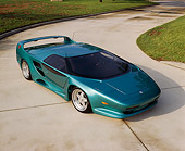 AUT 25 RK0095 04
1992-93 Vector/Avtech SC Green Overhead 3/4 Front View On Pavement By Grass