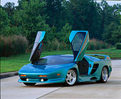 AUT 25 RK0097 01
1992-93 Vector/Avtech SC Turquoise 3/4 Front View Doors Open On Pavement By Grass And Trees