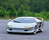 AUT 25 RK0127 03
1996 Vector M-12 Silver 3/4 Front View On Pavement Trees Background