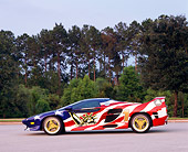 AUT 25 RK0161 02
1996 Vector M-12 Patriotic Side View On Pavement Trees Background
