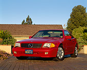 AUT 25 RK0203 02
1994 Mercedes-Benz 600SL Roadster Red 3/4 Front View On Driveway By House