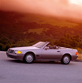 AUT 25 RK0237 01
1990 Mercedes-Benz 500SL Convertible Silver 3/4 Side View On Pavement Filtered