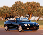 AUT 25 RK0289 04
1996 Toyota Celica 25th Anniversary Convertible Black 3/4 Front View By Trees