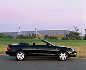 AUT 25 RK0290 01
1996 Toyota Celica 25th Anniversary Black Profile On Road By Shoreline At Dusk