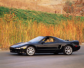 AUT 25 RK0318 04
1996 Acura NSX Black 3/4 Side View On Pavement By Tall Dry Grass