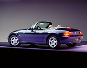 AUT 25 RK0343 01
1996 BMW Z3 Convertible Blue 3/4 Rear View On Purple Floor Studio