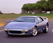 AUT 25 RK0344 01
1995 Lotus Esprit S4S Silver 3/4 Front View On Pavement By Trees