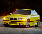AUT 25 RK0422 01
1995 BMW M3 Yellow 3/4 Front View On Pavement At Dusk