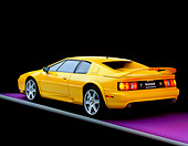 AUT 25 RK0437 06
1997 Lotus Esprit V8 Yellow Rear 3/4 View On Purple Floor Gray Line Studio