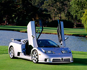 AUT 25 RK0442 11
1994 Bugatti EB110 SS Silver Doors Open 3/4 Front View On Grass By Pond