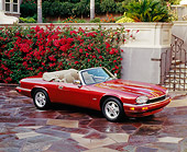 AUT 25 RK0463 01
1995 Red XJS Jaguar Convertible Overhead 3/4 Side On Driveway By Flowers