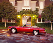 AUT 25 RK0464 01
1995 Jaguar XJS Convertible Profile View On Driveway At Night
