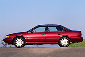 AUT 25 RK0493 02
1993 Ford Taurus Burgundy Profile View On Pavement Blue Sky