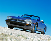 AUT 25 RK0589 02
1990 Jaguar XJS Sport Convertible Blue 3/4 Low Front View On Pavement Blue Sky