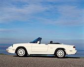 AUT 25 RK0624 04
1994 Alfa Romeo Spider Veloce Convertible White Low Profile On Pavement Blue Sky