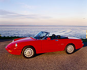 AUT 25 RK0630 01
1994 Alfa Romeo Spider Veloce Convertible Red 3/4 Side View On Pavement By Water
