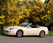 AUT 25 RK0637 03
1994 Nissan 300ZX Convertible White 3/4 Side View On Pavement By Trees