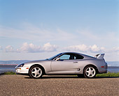 AUT 25 RK0645 02
1994 Toyota Supra Twin Turbo Silver Profile View On Pavement Cloudy Blue Sky