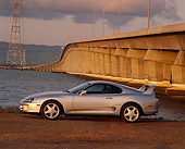 AUT 25 RK0648 26
1994 Toyota Supra Twin Turbo Silver Profile On Gravel By Water Bridge And Telephone Poll Gray Clouds At Dusk